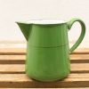 Charming vintage green metal pitcher with elegant design and nostalgic appeal for any kitchen.