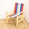 Vibrant red, white, and blue wooden chair, perfect for outdoor patio or garden use.