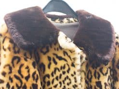 Stylish leopard print faux fur coat with elegant brown collar for bold fashion statements.