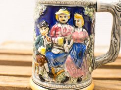 Vibrant ceramic beer mug featuring historical figures, perfect for collectors and festive gatherings.