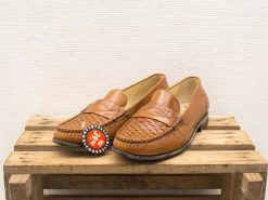 Stylish brown leather loafers for men with a woven design and comfortable cushioning.