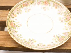 Elegant floral porcelain plate with gold rim, perfect for special occasions or decorative use.