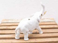 Elegant porcelain elephant figurine with gold accents, perfect for decor or as an incense holder.