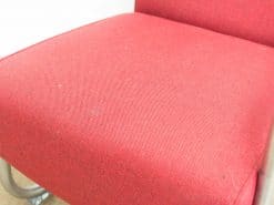 Vibrant red woven chair, perfect for modern interiors and everyday comfort.