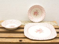 Vintage rose porcelain tableware set, featuring elegant bowls and plates for charming dining experiences.