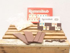 Classic Rummikub set on rustic wood table, perfect for family game night fun.