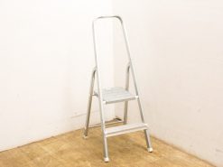 Stylish aluminum stepladder, lightweight and safe, perfect for reaching high places at home.