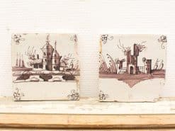 Vintage hand-painted tiles featuring serene landscape and castle designs for nostalgic decor.