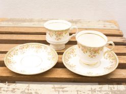 Elegant vintage floral tea set with gold trim, perfect for afternoon tea or decor.