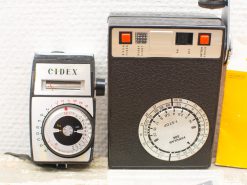 Vintage CIDEX and Poudrar light meters from the 1960s, showcasing timeless photographic craftsmanship.