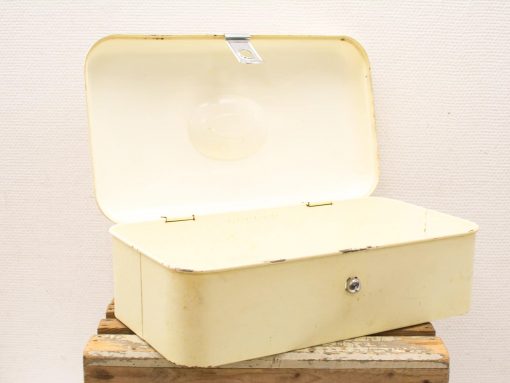 Charming vintage yellow metal storage box with a rustic design and ample space for keepsakes.