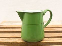 Charming vintage green metal pitcher with elegant design and nostalgic appeal for any kitchen.