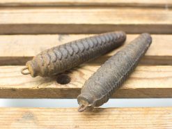 Vintage pinecone-shaped metal weights, ideal for rustic decor and antique enthusiasts.