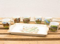 Charming vintage porcelain tray and unique cups showcasing cultural landmarks, perfect for collectors.