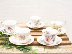 Charming vintage teacups with floral designs, perfect for elegant tea gatherings and collectors.