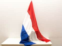 Vibrant red, white, and blue Dutch flag elegantly draped, symbolizing national pride and patriotism.