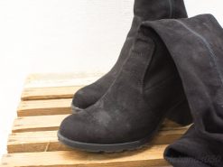 Chic black suede ankle boots perfect for winter styling with tights for added warmth.