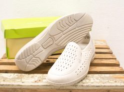 Comfortable white slip-on shoes with ventilation, perfect for summer casual wear.