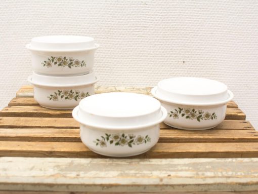 Vintage floral design ceramic casseroles, elegant and functional for serving delightful meals.