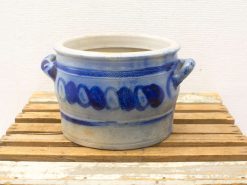 Elegant off-white ceramic pot with blue swirl design, perfect for decor or practical use.