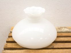 Elegant white ceramic vase with scalloped edge, perfect for flowers or decorative display.