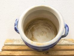 Vintage blue ceramic pot with handles, featuring intricate patterns and a rustic finish.