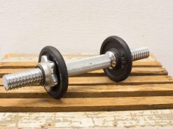 Chrome dumbbell with rubber weights for effective strength training and workouts.