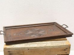 Elegant wooden tray with metal handles, featuring intricate floral design and raised edges.