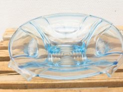 Elegant blue glass bowl, perfect for serving fruits and enhancing any dining experience.