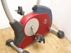 Modern red-gray exercise bike designed for comfort and effective home workouts.