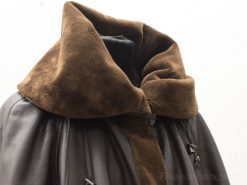 Stylish dark brown leather and suede jacket with oversized collar for chic comfort.