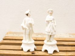 Elegant vintage porcelain couple figurines with intricate details, ideal for collectors and decor.