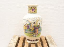 Elegant hand-painted porcelain vase with cultural scenes, adding charm to any collection.