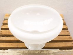 Elegant white porcelain bowl on pedestal, perfect for decorative use and versatile styling.