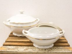 Elegant white porcelain serving dishes with gold accents for special occasions and everyday dining.