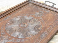 Beautiful wooden tray with floral carvings, perfect for vintage home decor and style.