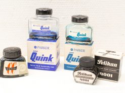 Vintage Parker and Pelikan ink bottles, ideal for collectors and writing enthusiasts.