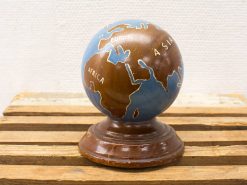 Vintage blue and brown globe decoration, perfect for geography lovers and classic design enthusiasts.