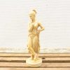 Elegant female statue in classical style with intricate details and serene expression.