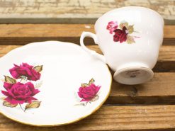 Elegant rose teacup and saucer set in fine bone china, perfect for tea parties.