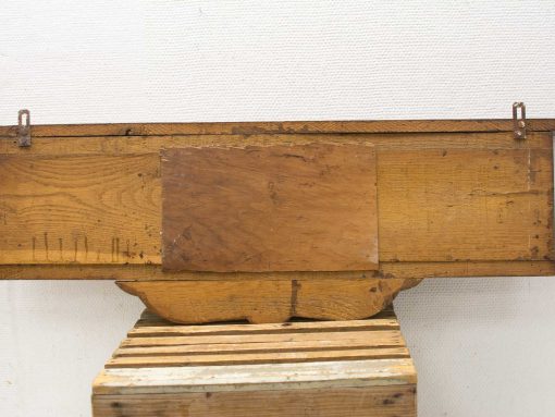 Rustic wooden wall shelf with hooks, featuring unique grain and warm, weathered tones.