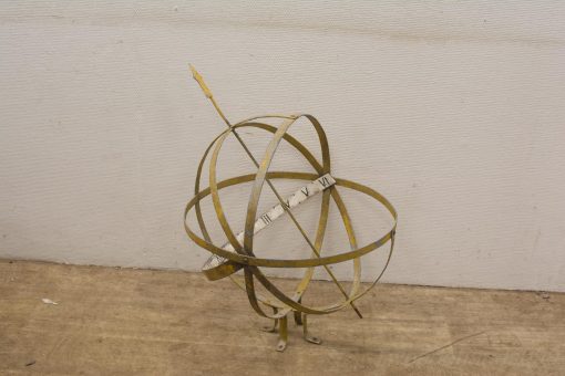 Vintage brass armillary sphere with gnomon, featuring Roman numerals and elegant design.