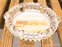 Vintage crystal ashtray with a nostalgic photo of an old building and car.