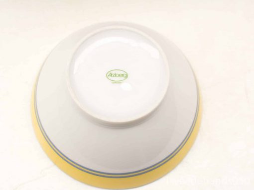 Stylish Aziberg bowl with glossy white interior, green logo, and charming yellow accent band.