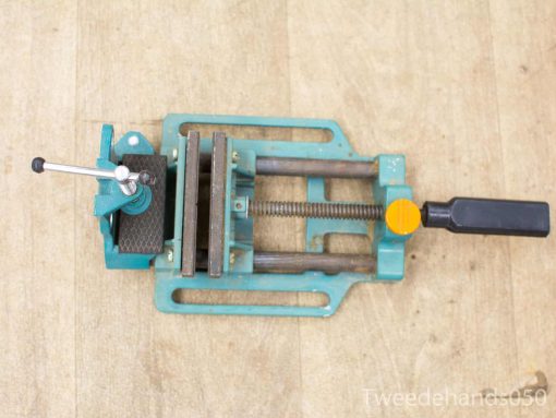 Vintage teal vice with sturdy jaws, comfortable grip, and quick-release for woodworking and metalworking.