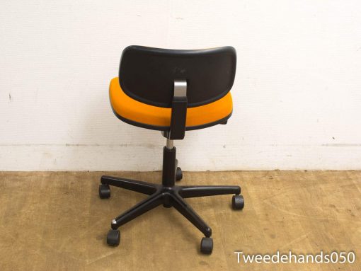 Sleek ergonomic office chair with vibrant orange seat and sturdy black backrest for modern workspaces.