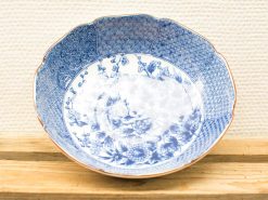 Decorative blue and white ceramic bowl with intricate floral and geometric patterns.