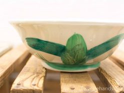 Hand-painted ceramic bowl with vibrant floral design in green, perfect for serving or decor.