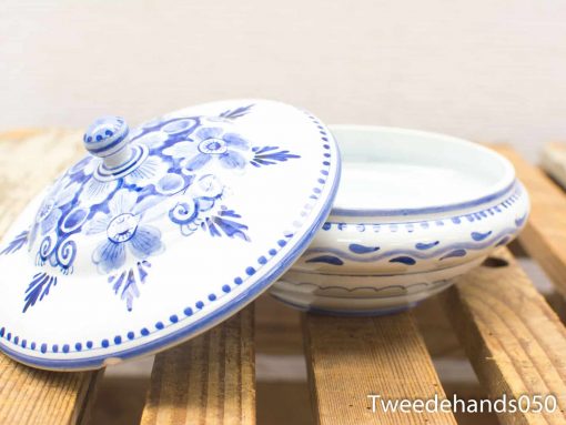 Elegant blue floral ceramic dish with lid, perfect for serving or decorative display.