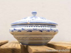 Elegant ceramic dish with blue patterns, perfect for serving or as a decorative collectors item.